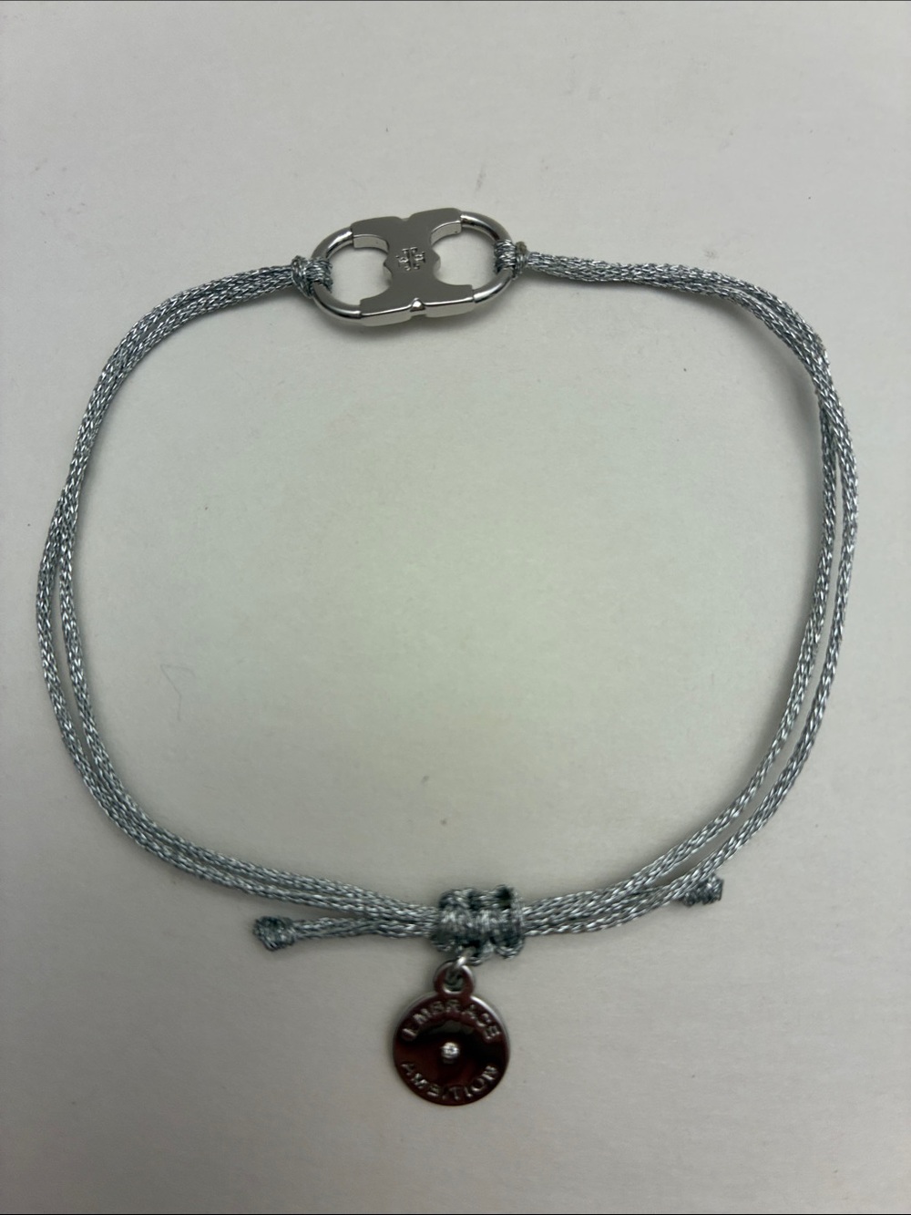 Tory Burch Adjustable Cord Silver Bracelet with Embrace Ambition charm